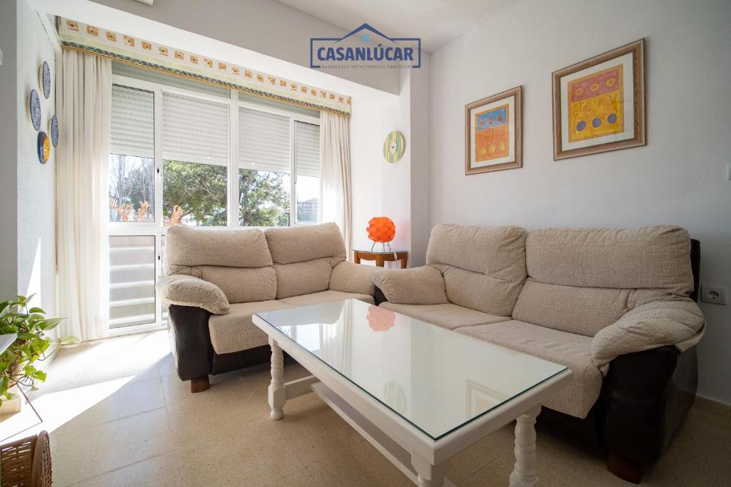 a living room with a couch and a coffee table at Apartamento mi Gitana in La Jara