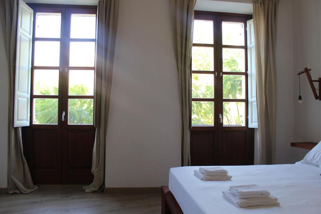 Postel nebo postele na pokoji v ubytování Art Guest House