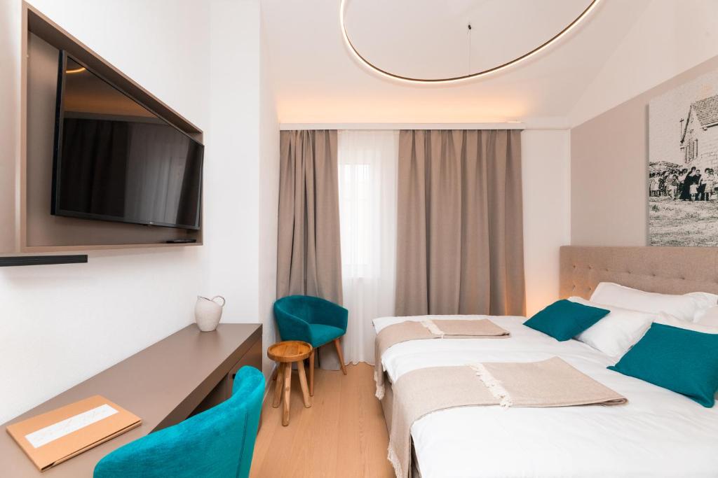 Postel nebo postele na pokoji v ubytování Hotel Sveta Ana