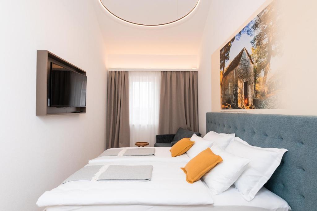 Postel nebo postele na pokoji v ubytování Hotel Sveta Ana