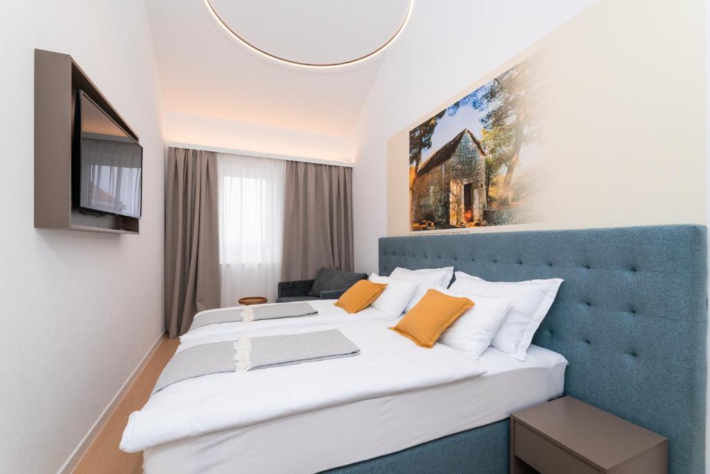 Postel nebo postele na pokoji v ubytování Hotel Sveta Ana