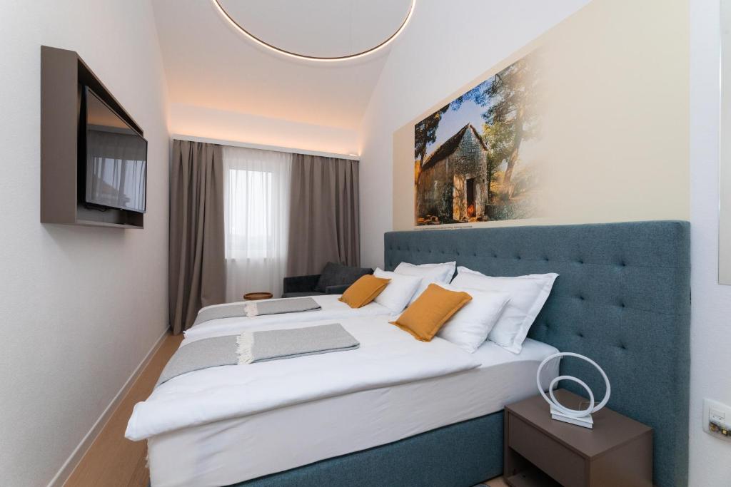 Postel nebo postele na pokoji v ubytování Hotel Sveta Ana