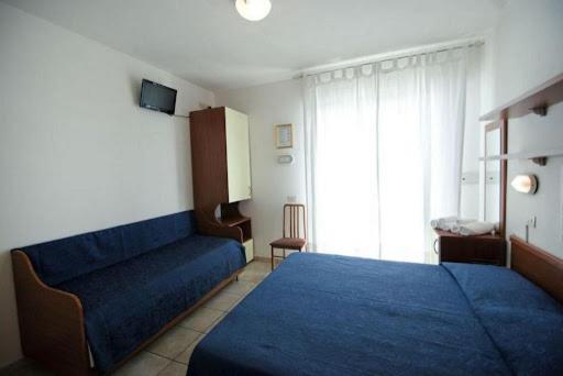 Postel nebo postele na pokoji v ubytování Nuovo hotel ANTHISA