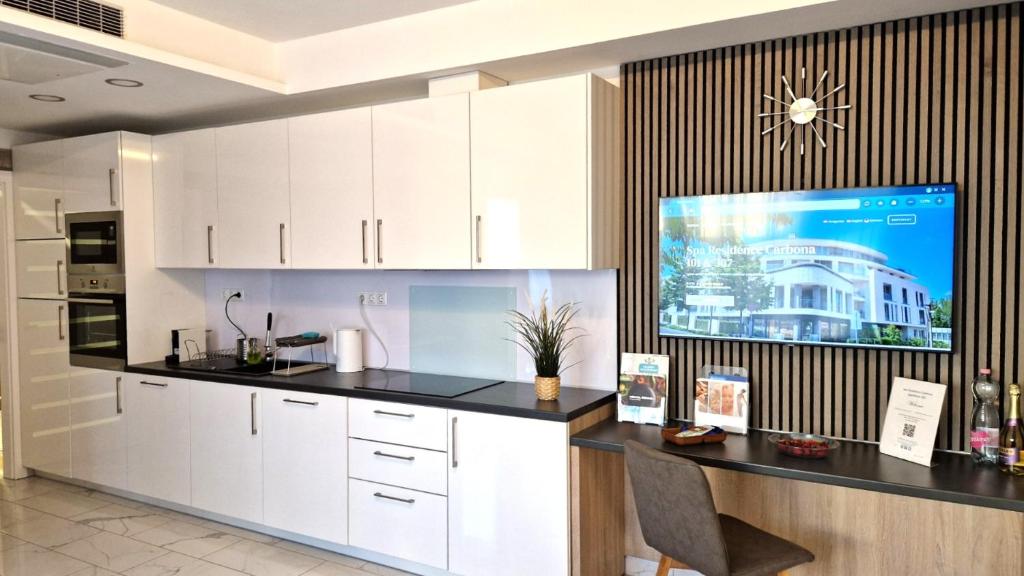 Kuchyňa alebo kuchynka v ubytovaní Spa Residence Carbona 101, 307 Apartman