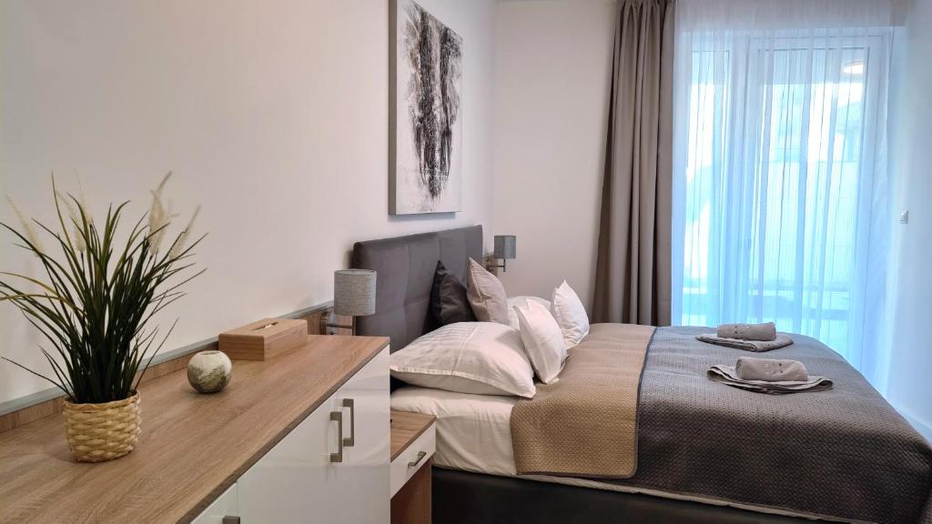 Posteľ alebo postele v izbe v ubytovaní Spa Residence Carbona 101, 307 Apartman