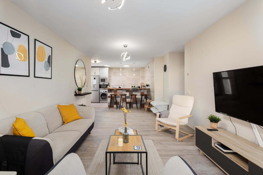 TV a/nebo společenská místnost v ubytování Nordik Rooms Urban - Segalerva "Geiranger"