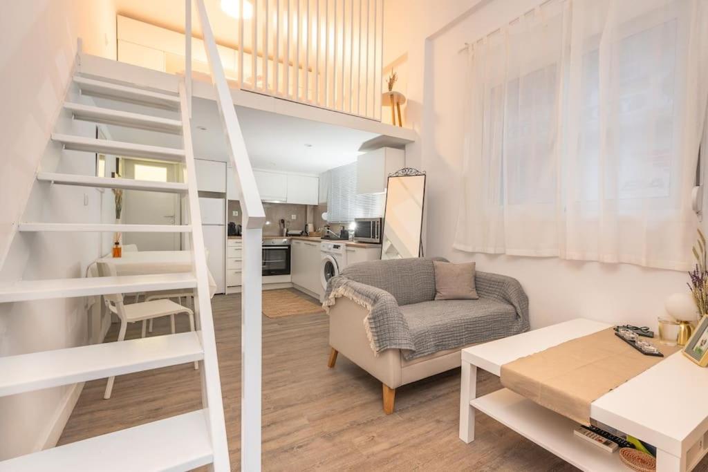 a living room with a loft bed and a kitchen at Cosy Nest in Athens 4' to Metro Station Petralona in Athens