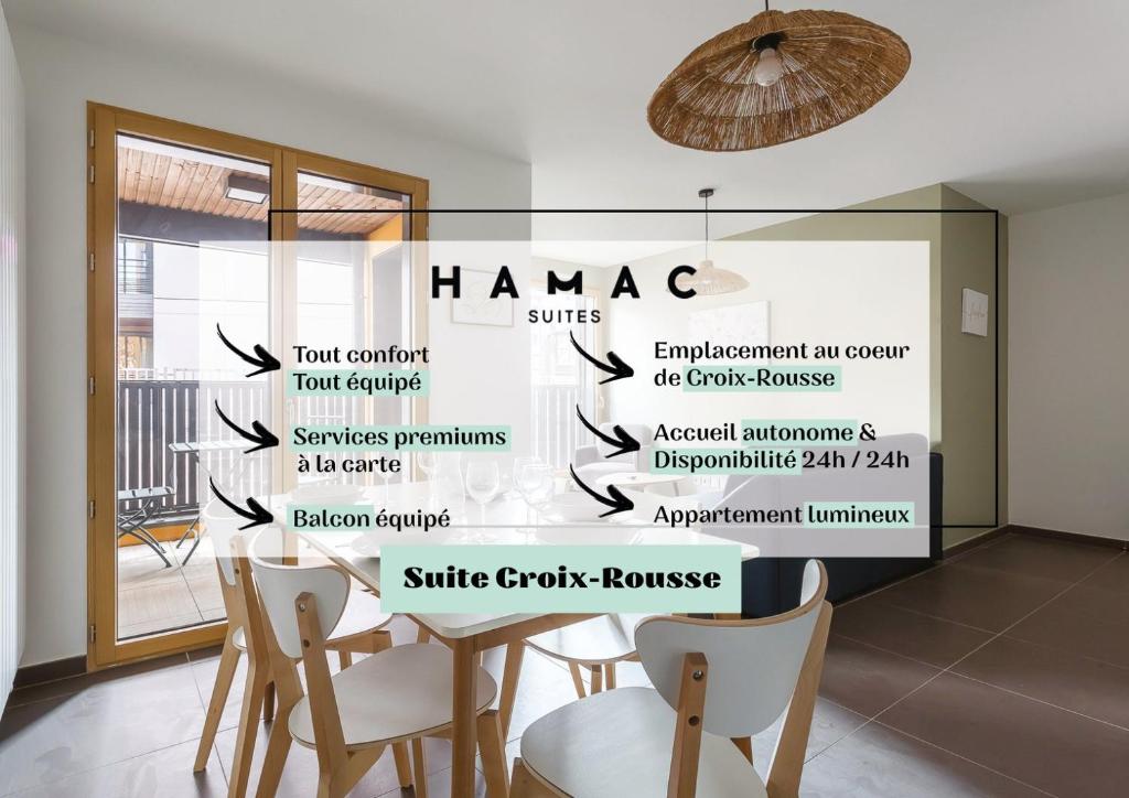 a room with a table and chairs and a sign that says hamage at Suite Croix-Rousse : T3 avec patio ! in Lyon