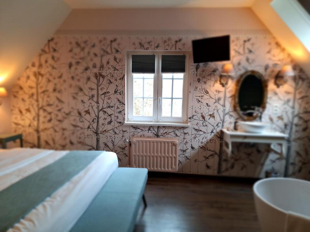 Postel nebo postele na pokoji v ubytování Chambres d'hôtes - Au Clos d'Amande