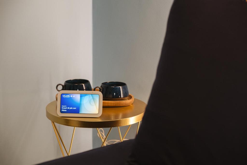 TV a/nebo společenská místnost v ubytování ALBERGO DIFFUSO Dimora Rossi Charme B&B