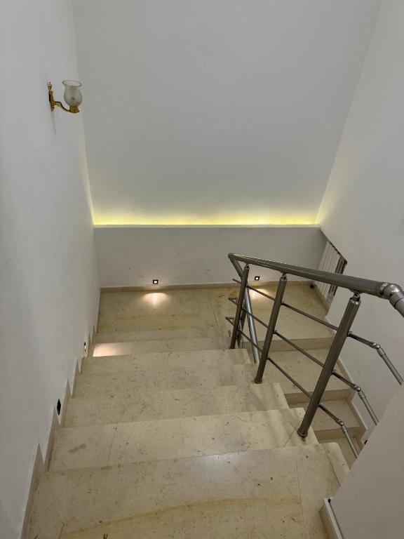 a stairway with a table on top of it at Duplex s3 richement meublé à mars in Tunis