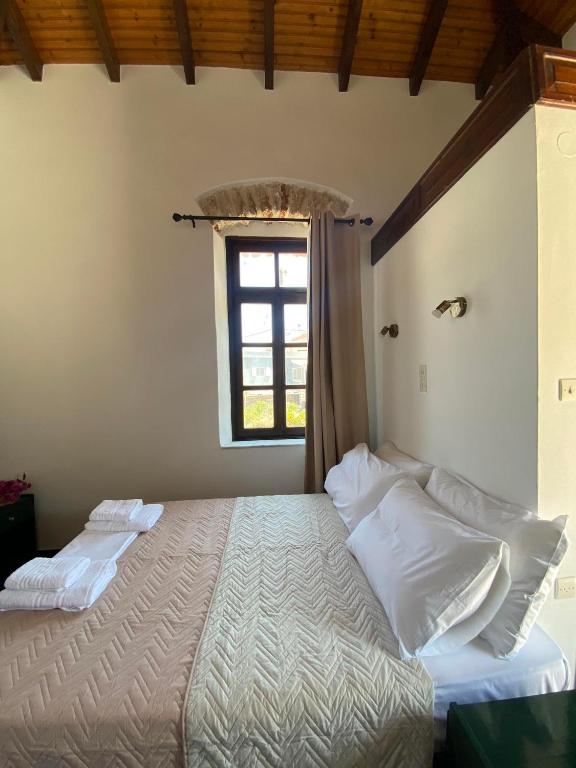 Postel nebo postele na pokoji v ubytování Belessi's Mansion 1