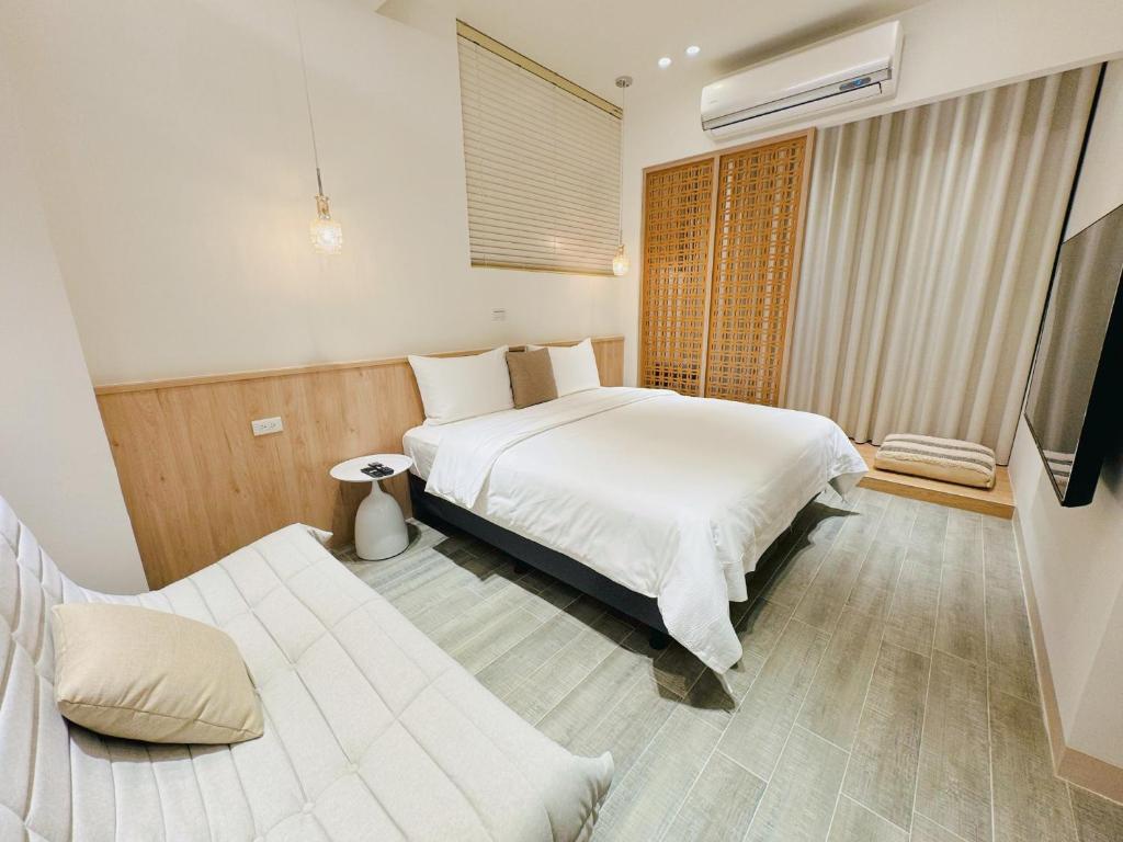 Postel nebo postele na pokoji v ubytování Enjoy Homestay