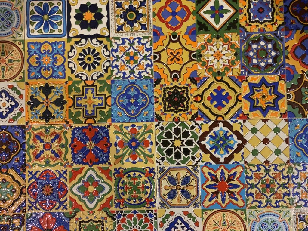 a tile wall with a bunch of different colored tiles at Church Retreat - A Magnificent Seaside Apartment-Award Winning in Hastings