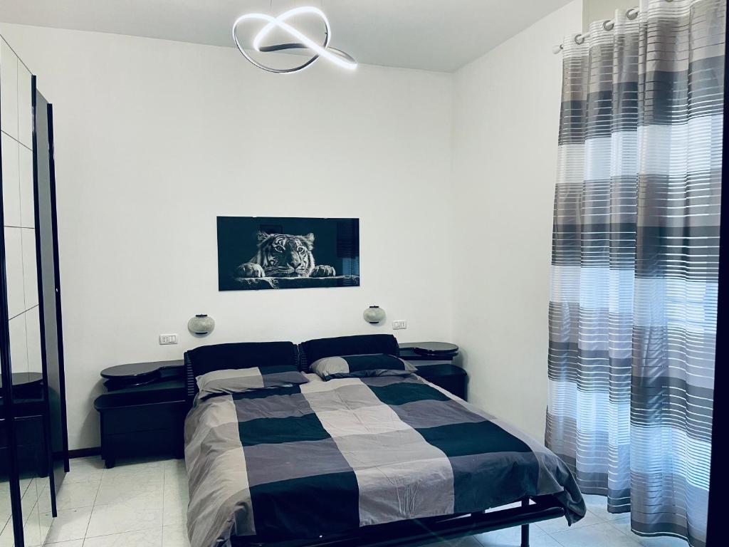 Uma cama ou camas num quarto em Appartamenti Lago di Como