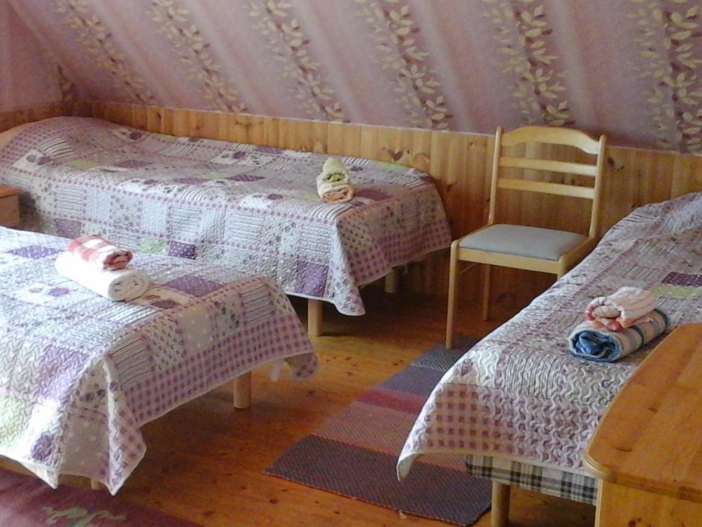 Postel nebo postele na pokoji v ubytování Tõnise Holiday Houses