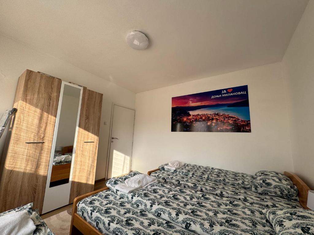 Postel nebo postele na pokoji v ubytování Vuk Apartman
