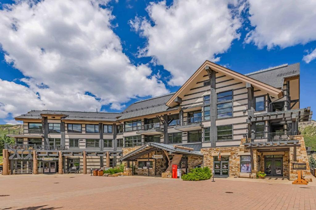 an exterior view of a large building at Hayden Lodge by Snowmass Mountain Lodging in Snowmass Village