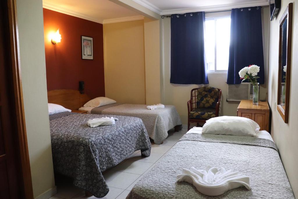 Postel nebo postele na pokoji v ubytování Hotel Toledo