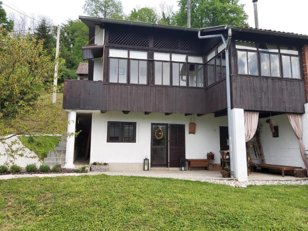 a large house with a porch and a front yard at Kuća za odmor Anka in Krapina