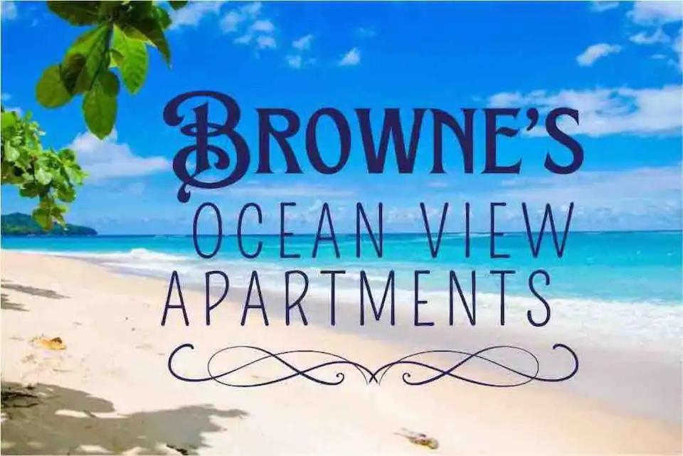 a picture of a beach with the words browns ocean view apartments at Browne’s Oceanview Apartments in Arnos Vale