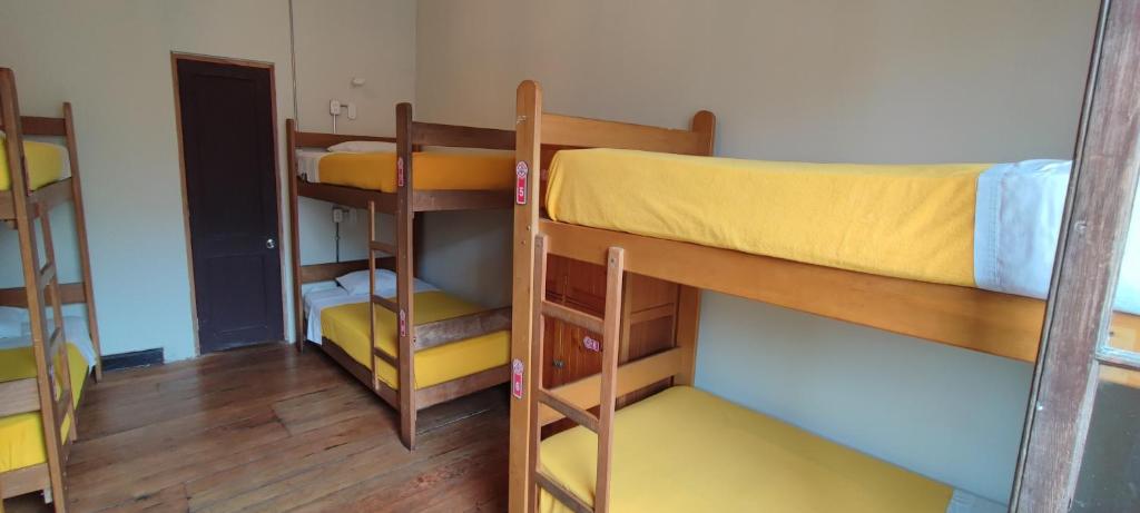 Postel nebo postele na pokoji v ubytování Flying Dog Lima B&B