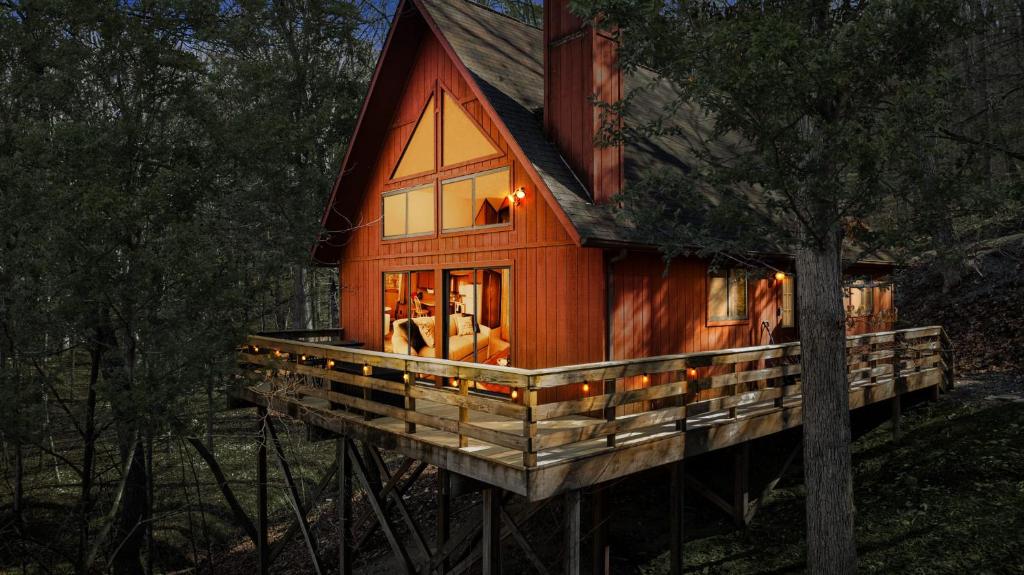 a cabin in the woods with a tree at Chalet w Huge Deck, Grill, WiFi, Mins to Bryce! in Basye