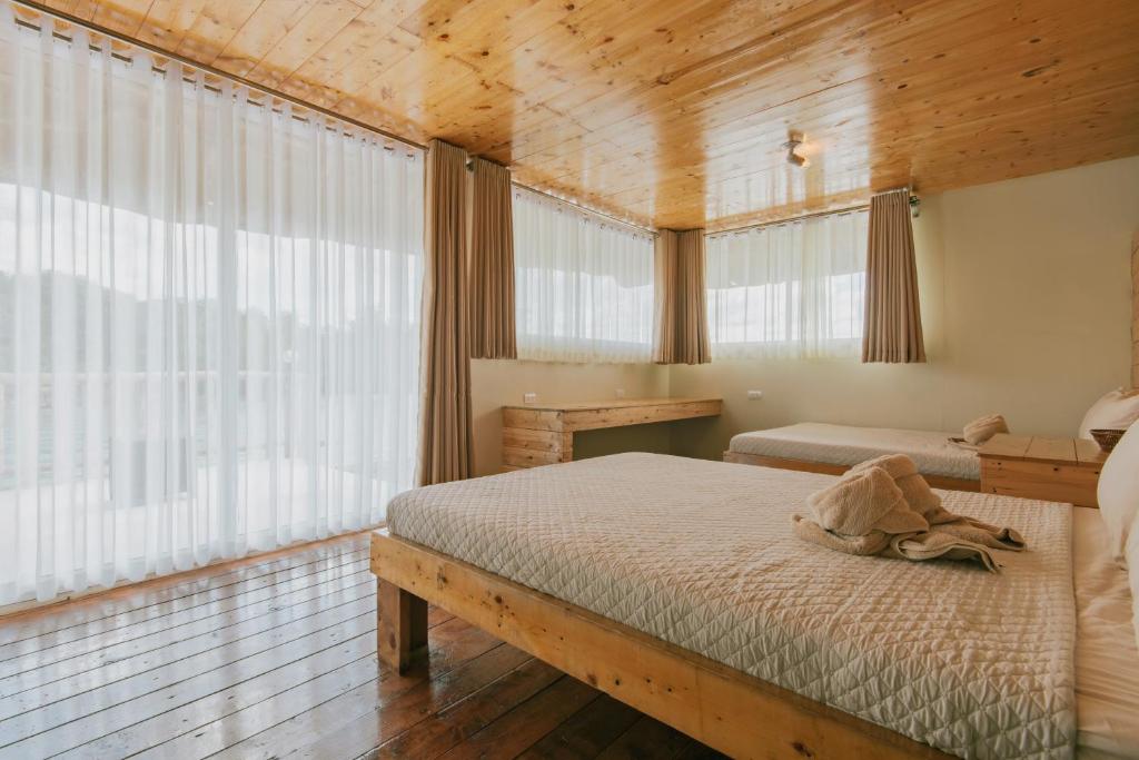 Postel nebo postele na pokoji v ubytování Kaway Resort & Spa