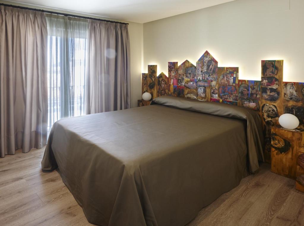 Posteľ alebo postele v izbe v ubytovaní Hotel Galería Essentia