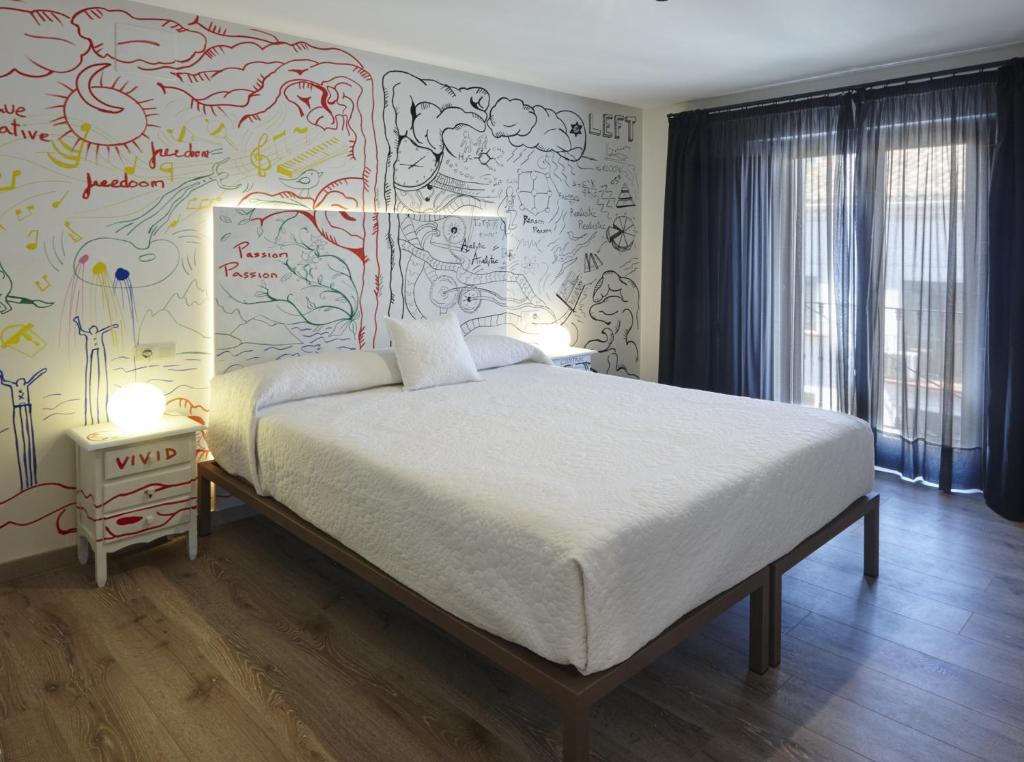 Posteľ alebo postele v izbe v ubytovaní Hotel Galería Essentia