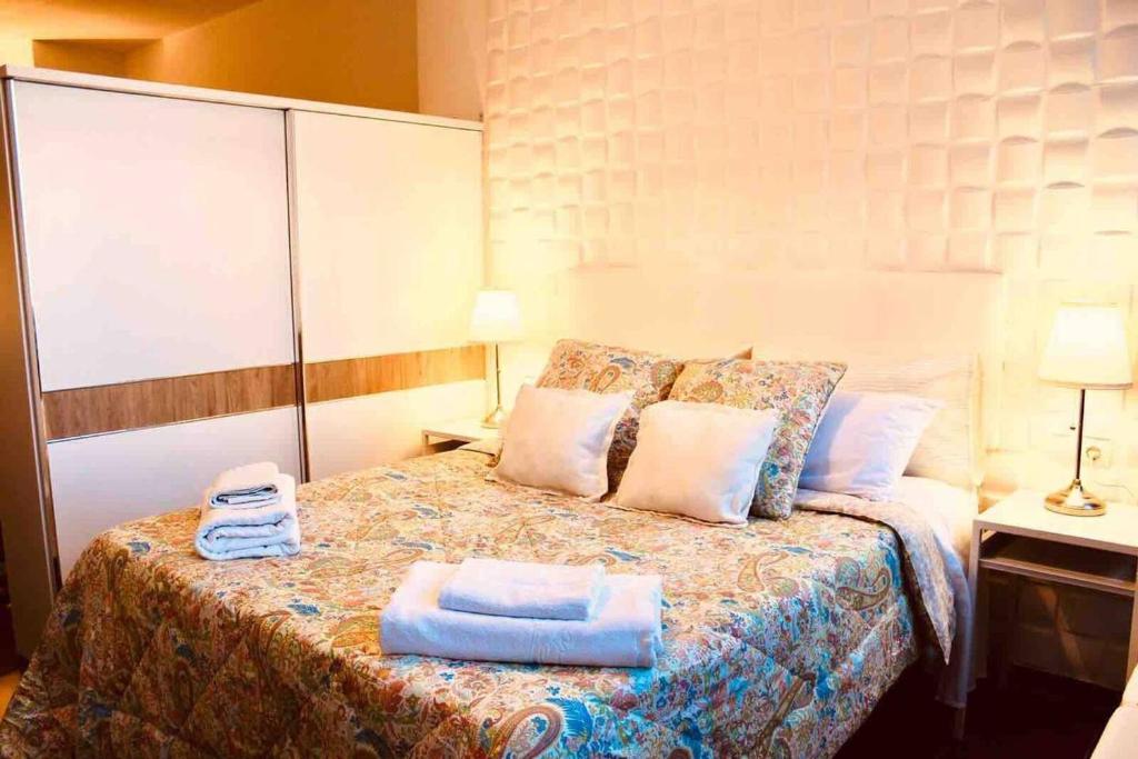 a bedroom with a bed with two towels on it at One bedroom appartement at Torremolinos 900 m away from the beach with wifi in Torremolinos
