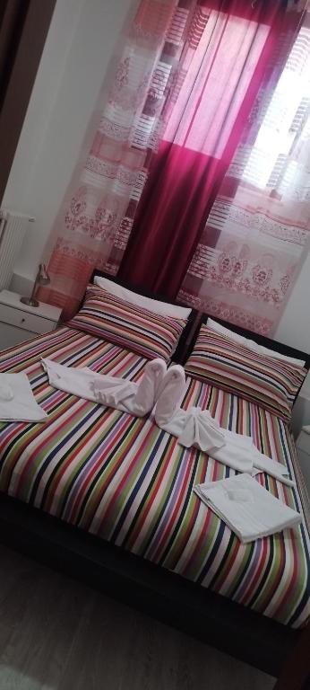 Een bed of bedden in een kamer bij B&B MANITO