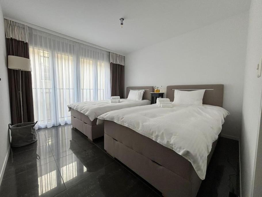 Postel nebo postele na pokoji v ubytování Center Park Apartment