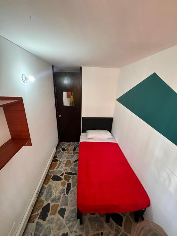 Postel nebo postele na pokoji v ubytování Hostel Bogotá Normandia Tu sitio