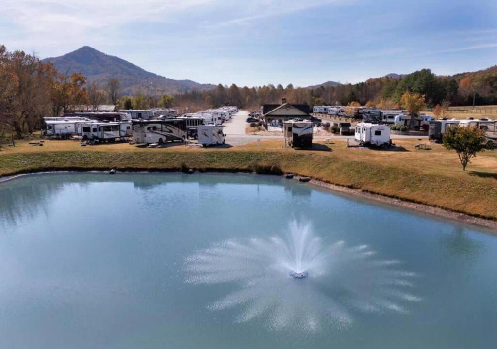 a large pool of water next to a bunch of rvs at Picturesque Family Cabin with Loft in Tennessee in Sevierville