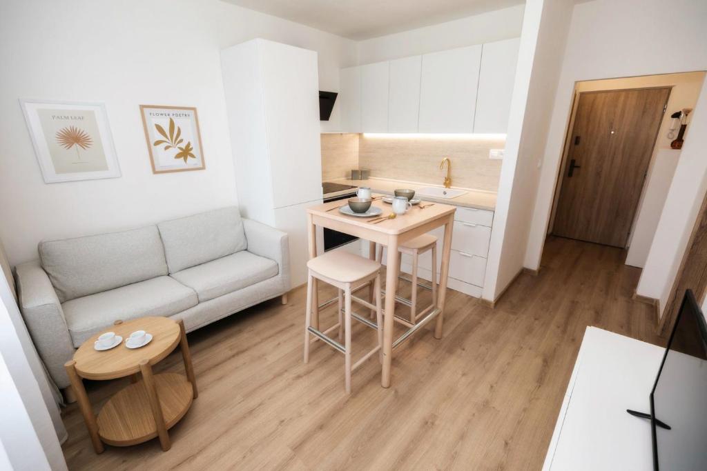 a small living room with a couch and a table at Bonnie&Beauty apartment in Banská Bystrica