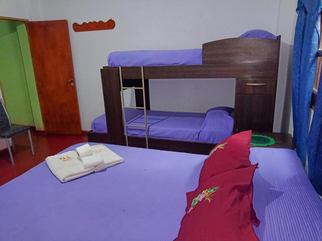 Postel nebo postele na pokoji v ubytování Hostal Benjamin
