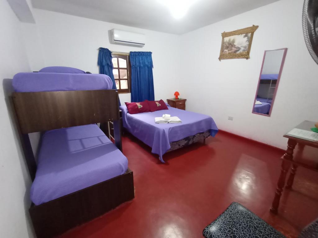 Postel nebo postele na pokoji v ubytování Hostal Benjamin