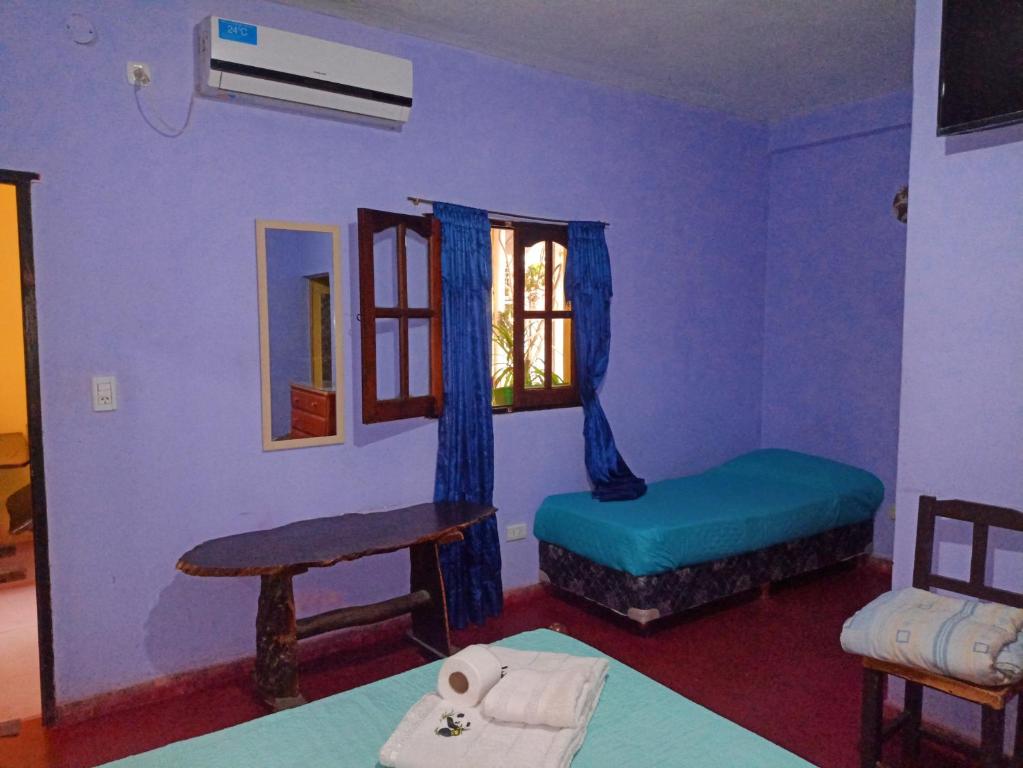 Postel nebo postele na pokoji v ubytování Hostal Benjamin