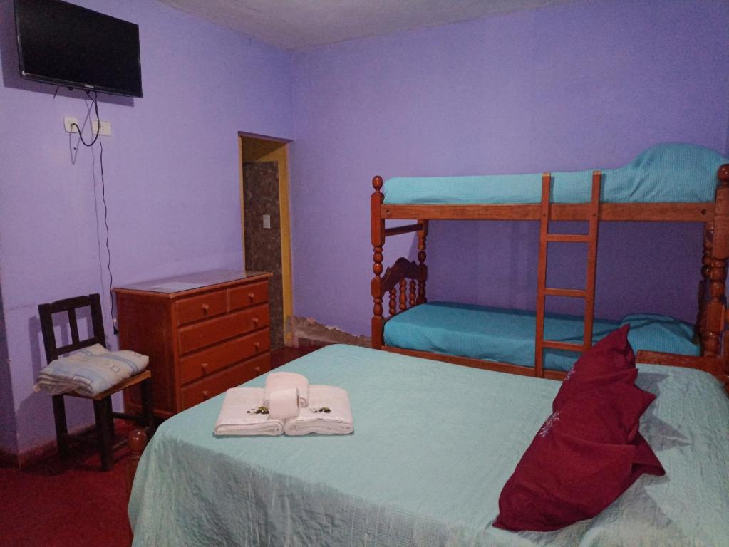 Postel nebo postele na pokoji v ubytování Hostal Benjamin