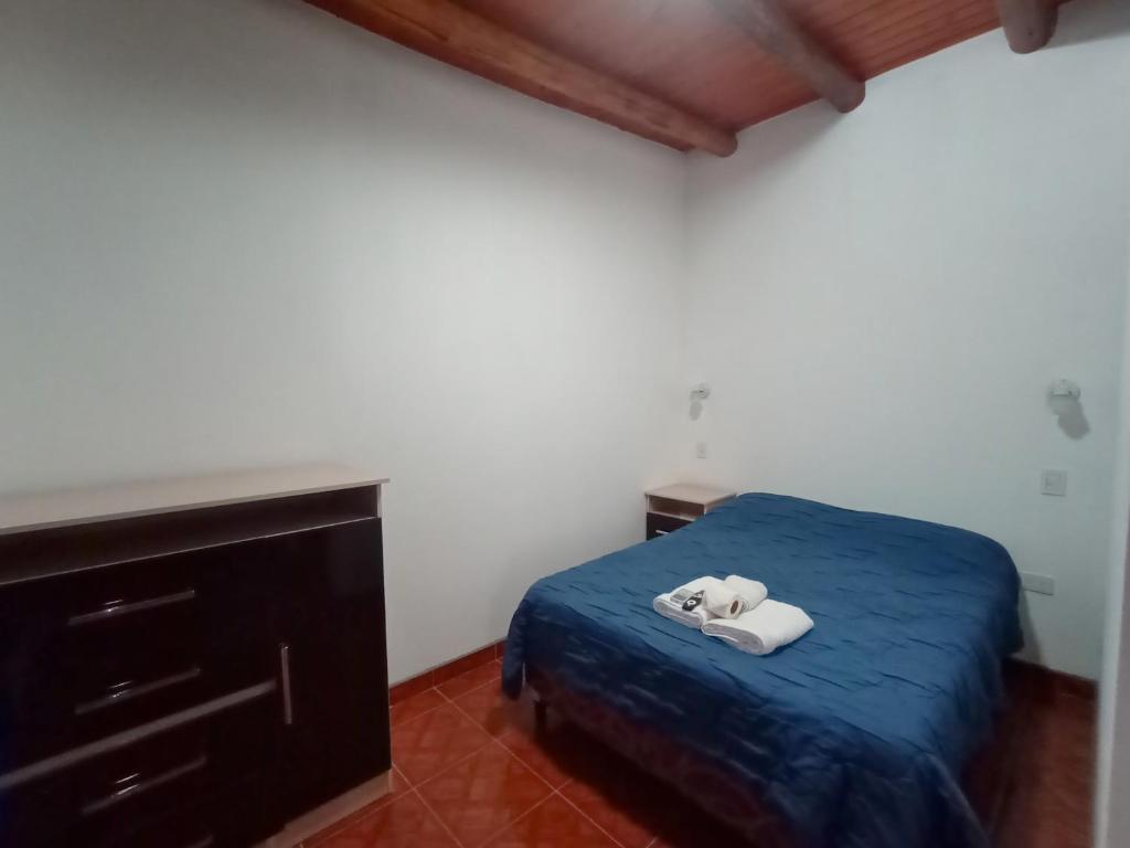 Postel nebo postele na pokoji v ubytování Hostal Benjamin