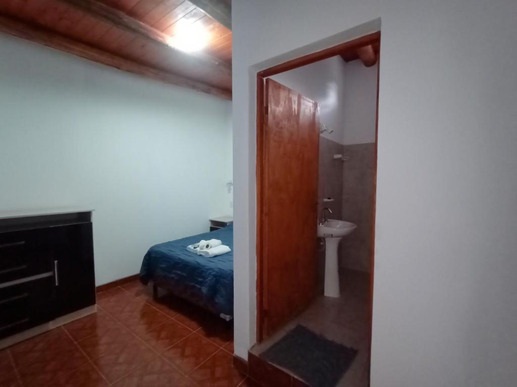 Postel nebo postele na pokoji v ubytování Hostal Benjamin