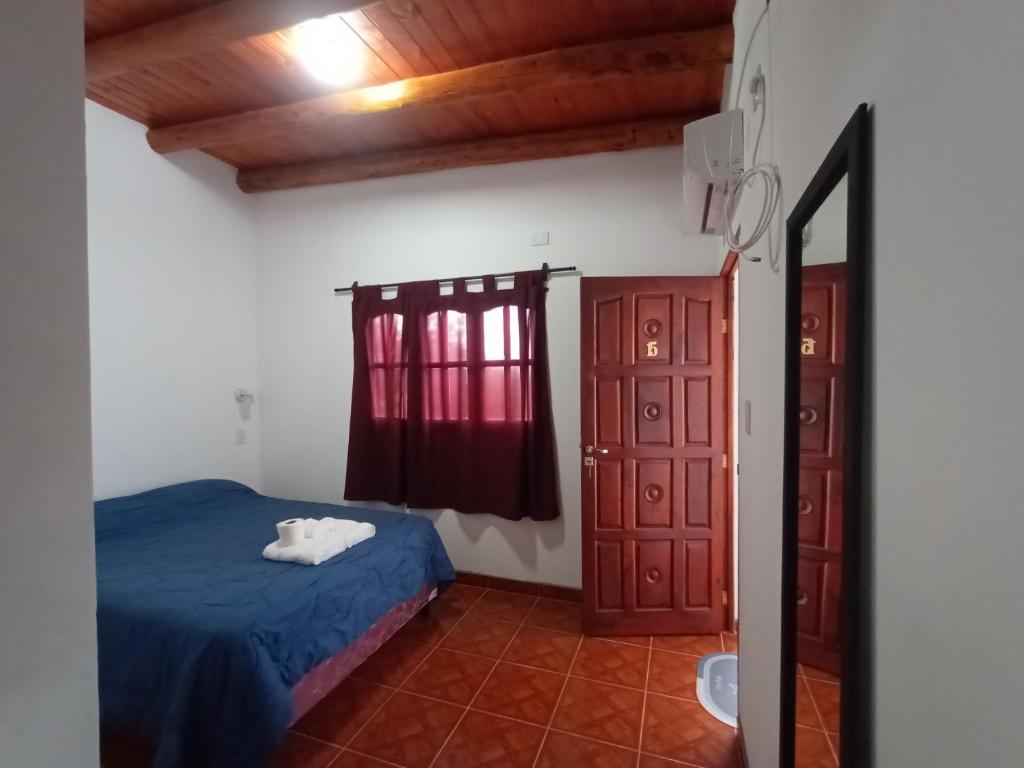 Postel nebo postele na pokoji v ubytování Hostal Benjamin