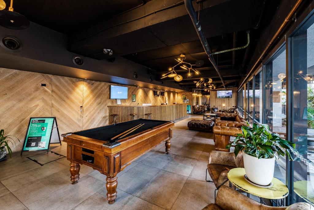 a billiard room with a pool table in it at Bunk Surfers Paradise International Backpacker Hostel in Gold Coast