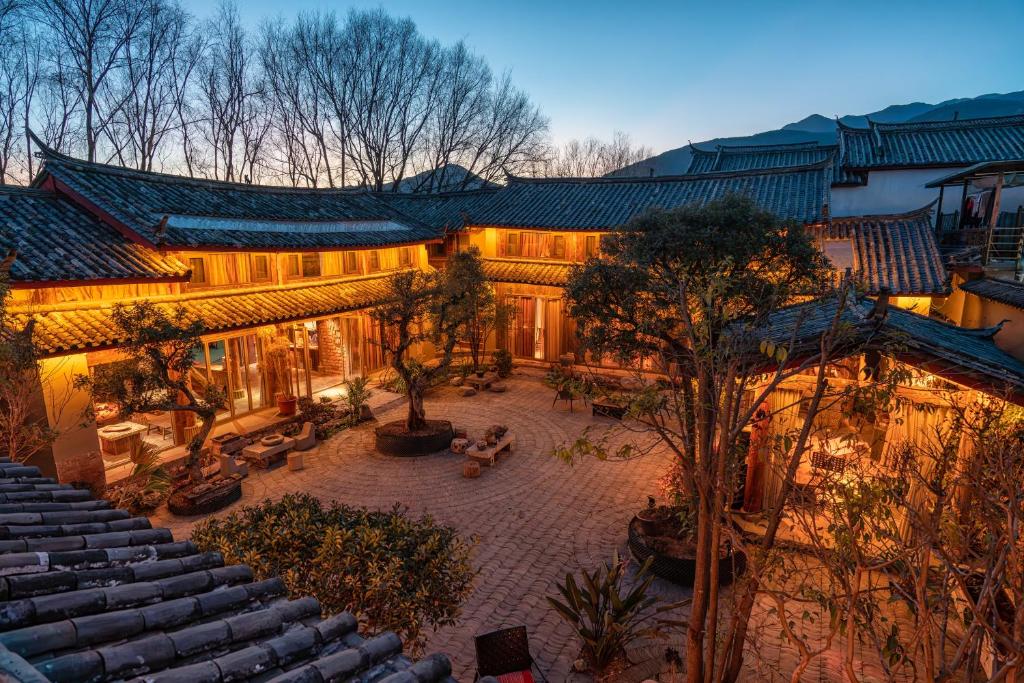 an overhead view of a building with a courtyard at Qushe Snowy Mountain View Art B&B in Lijiang