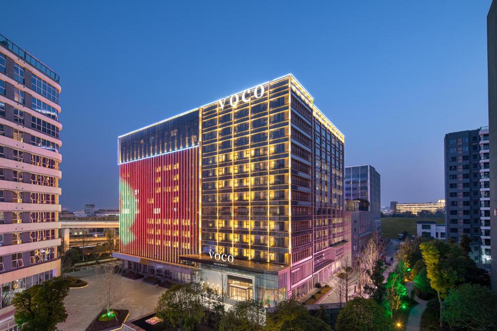 a rendering of a tall building in a city at voco Changsha Airport, an IHG Hotel in Changsha