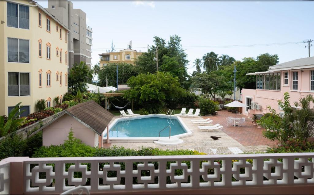 a view of a swimming pool from a balcony at The Monteray Hotel in Christ Church