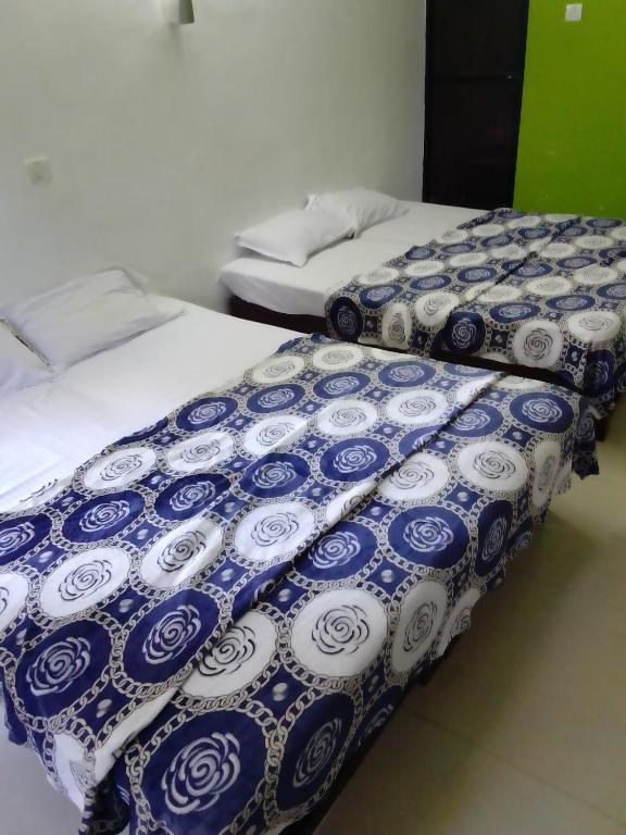 Postel nebo postele na pokoji v ubytování Hotel Beach side calangute