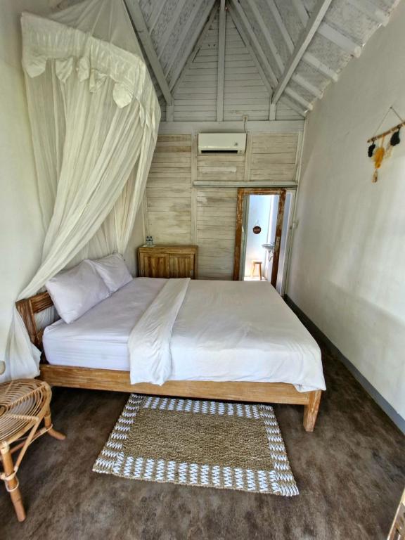 a bedroom with a large bed in a tent at The Layar Homestay in Nusa Penida