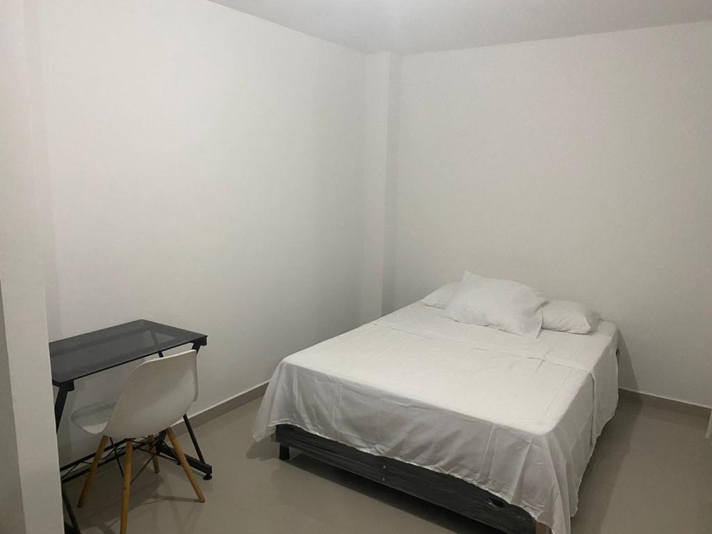 Postel nebo postele na pokoji v ubytování HOTEL IBIZA